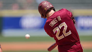 May 25, 2024; Charlotte, NC, USA; Florida State outfielder James Tibbs III (22) hits a ball in the second inning against Wake Forest during the ACC Baseball Tournament at Truist Field. 