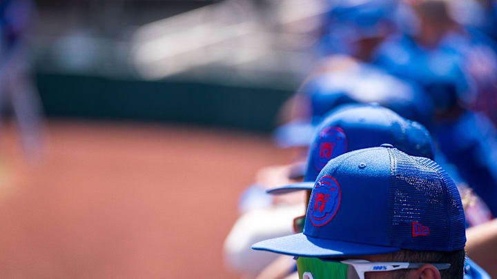 Mar 18, 2023; Scottsdale, Arizona, USA;  A general view hats belonging to Chicago Cubs players in the dugout during the first inning during a spring training game against the San Fracisco Giants at Scottsdale Stadium.  Allan Henry-Imagn Images.