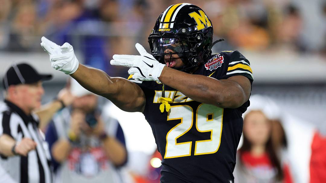 Missouri Tigers running back Ahmad Hardy reacts to his first down pickup during the first quarter of the TaxSlayer Gator Bowl Missouri Tigers running back Ahmad Hardy reacts to his first down pickup during the first quarter of the TaxSlayer Gator Bowl
