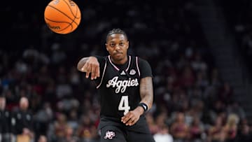  Wade Taylor IV (4) of the Texas A&M Aggies passes the ball during the first half of an NCAA men's basketball game against the South Carolina Gamecocks at Colonial Life Arena on February 1, 2024 in Columbia, South Carolina. The Aggies won 76-72.