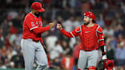 Jun 3, 2025; Boston, Massachusetts, USA; Los Angeles Angels relief pitcher Kenley Jansen (74) and Los Angeles Angels catcher Travis d'Arnaud (25) fist bump during the ninth inning against the Boston Red Sox at Fenway Park. Mandatory Credit: Paul Rutherford-Imagn Images