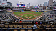 Jun 26, 2025; Minneapolis, Minnesota, USA; Sparsely seated fans watch the Seattle Mariners play the Minnesota Twins in the seventh inning after a nearly four and a half hour rain delay at Target Field. Mandatory Credit: Bruce Kluckhohn-Imagn Images