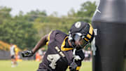 Aug 6, 2025; Columbia, MO, USA; Missouri Tigers wide receiver James Madison II (4) ducks around a tackle dummy at a Missouri fall camp practice at Mizzou Athletic Training Camp.