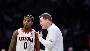 Feb 26, 2025; Tucson, Arizona, USA; Arizona Wildcats head coach Tommy Lloyd talks with guard Jaden Bradley (0) during the second half against the Utah Utes at McKale Center. Mandatory Credit: Aryanna Frank-Imagn Images