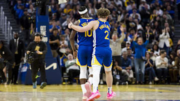 Feb 23, 2025; San Francisco, California, USA; Golden State Warriors guard Brandin Podziemski (2) and forward Jimmy Butler III (10) reacts during the fourth quarter of the game against the Dallas Mavericks at Chase Center. Mandatory Credit: John Hefti-Imagn Images