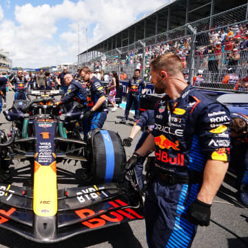 May 4, 2024; Miami Gardens, Florida, USA; Crewmembers work on the car of Red Bull Racing driver Max Verstappen (1) on the grid before the F1 Sprint Race at Miami International Autodrome. Mandatory Credit: John David Mercer-USA TODAY Sports
