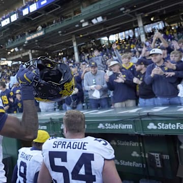 Nov 15, 2025; Chicago, Illinois, USA; Michigan Wolverines defensive back Brandyn Hillman (6) salutes the crowd after the game against the Northwestern Wildcats at Wrigley Field. Mandatory Credit: David Banks-Imagn Images
