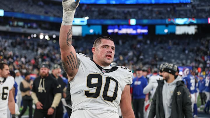 Dec 8, 2024; East Rutherford, New Jersey, USA; New Orleans Saints defensive tackle Bryan Bresee (90) celebrates after the game against the New York Giants at MetLife Stadium. Mandatory Credit: Vincent Carchietta-Imagn Images