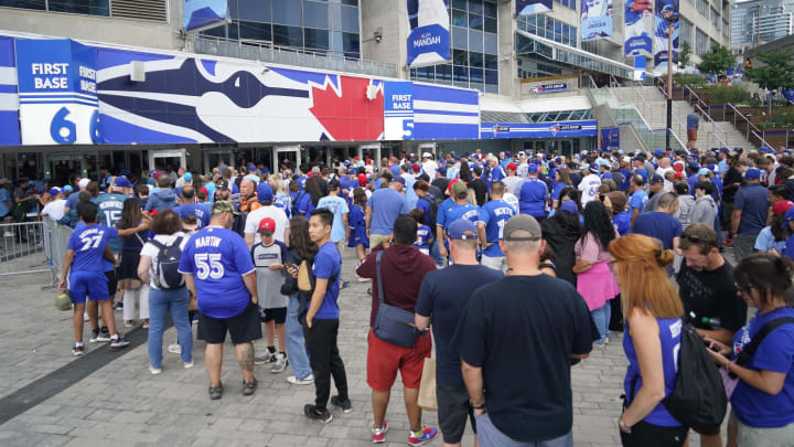 Aug 15, 2023; Toronto, Ontario, CAN; Toronto Blue Jays fans line up to get into Rogers Centre for