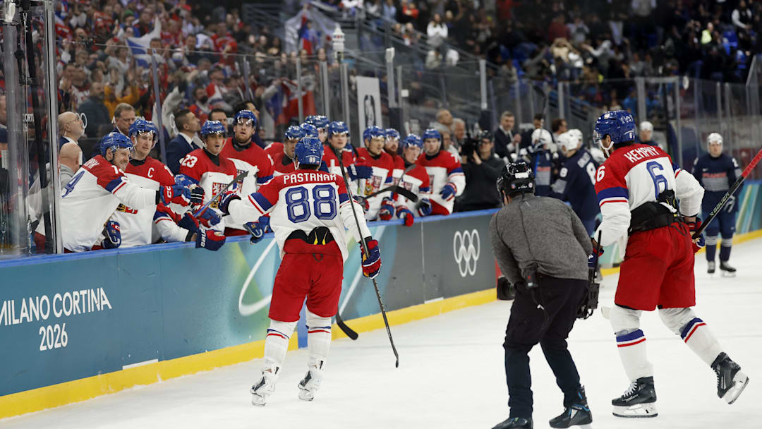Feb 13, 2026; Milan, Italy;  David Pastrnak of Czech Republic celebrates scoring their third goal with teammates  against France in men's ice hockey group A play during the Milano Cortina 2026 Olympic Winter Games at Milano Santagiulia Ice Hockey Arena. Mandatory Credit: Geoff Burke-Imagn Images