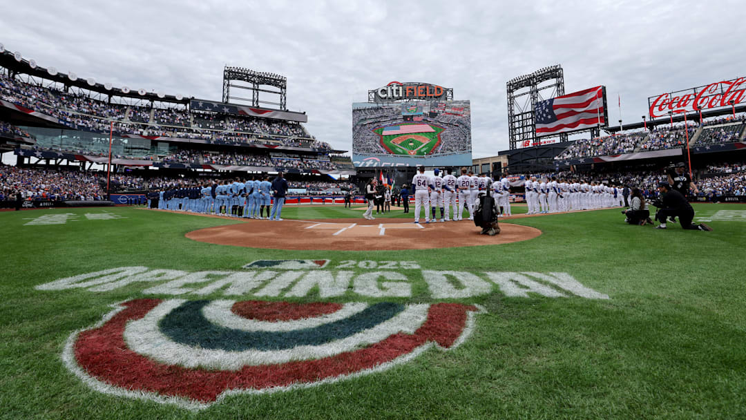 Apr 4, 2025; New York City, New York, USA; New York Mets and Toronto Blue Jays players stand on the baselines for the national anthem before the Mets home opener at Citi Field. Mandatory Credit: Brad Penner-Imagn Images