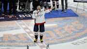 Apr 6, 2025; Elmont, New York, USA;  Washington Capitals left wing Alex Ovechkin (8) speaks after scoring in the during the second period during the game against the New York Islanders at UBS Arena. Ovechkin scored the 895th goal of his career, breaking the NHL all-time career goals record previously held by Wayne Gretzky at UBS Arena. Mandatory Credit: Geoff Burke-Imagn Images