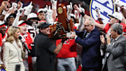 Dec 6, 2025; Atlanta, GA, USA; Georgia Bulldogs head coach Kirby Smart lifts the SEC Championship trophy after the game against the Alabama Crimson Tide during the 2025 SEC Championship game at Mercedes-Benz Stadium. Mandatory Credit: Brett Davis-Imagn Images
