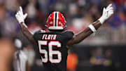 Oct 13, 2025; Atlanta, Georgia, USA; Atlanta Falcons defensive end Leonard Floyd (56) reacts after an interception during the second half of a game against the Buffalo Bills at Mercedes-Benz Stadium. Mandatory Credit: Brett Davis-Imagn Images