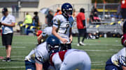 Arlington quarterback Leyton Martin throws a pass during the PLU Football Showcase in Parkland.