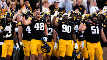 Iowa Hawkeyes football players do the wave after the first quarter against the Albany Great Danes Aug. 30, 2025 at Kinnick Stadium in Iowa City, Iowa.