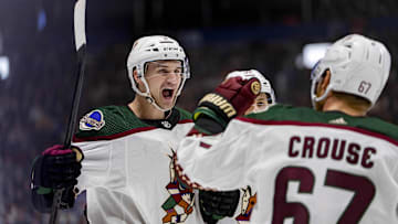 Apr 10, 2024; Vancouver, British Columbia, CAN; Arizona Coyotes defenseman Josh Brown (3) and defenseman Vladislav Kolyachonok (52) and forward Lawson Crouse (67) celebrate Brown’s goal against the Vancouver Canucks in the second period at Rogers Arena. Mandatory Credit: Bob Frid-USA TODAY Sports