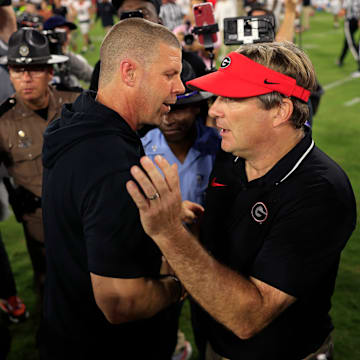 Florida Gators head coach Billy Napier, left, and Georgia Bulldogs head coach Kirby Smart shake hands after the game of an NCAA Football game Saturday, Oct. 28, 2023 at EverBank Stadium in Jacksonville, Fla. Georgia defeated Florida 43-20. [Corey Perrine/Florida Times-Union]