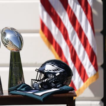Two Vince Lombardi Trophies, a helmet and jersey on a table before President Donald Trump honors the Super Bowl LIX champion Philadelphia Eagles at The White House in Washington D.C., on April 28, 2025.