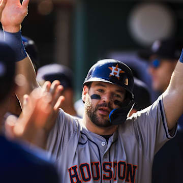 Sep 2, 2024; Cincinnati, Ohio, USA; Houston Astros outfielder Chas McCormick (20) high fives teammates after scoring on a two-run single hit by catcher Yainer Diaz (not pictured) in the third inning against the Cincinnati Reds at Great American Ball Park.