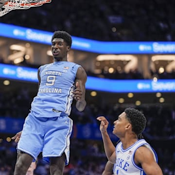 Mar 14, 2025; Charlotte, NC, USA; North Carolina Tar Heels guard Drake Powell (9) with a dunk against the Duke Blue Devils during the first half at Spectrum Center.