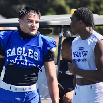 Graham-Kapowsin's Noah Flores, left, and Bethel's Zaydrius Rainey Sale participate in PLU football 11v11 Showcase in Parkland. 