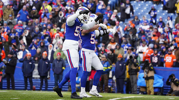 Jan 12, 2025; Orchard Park, New York, USA; Buffalo Bills linebacker Matt Milano (58) and defensive end Greg Rousseau (50) cel