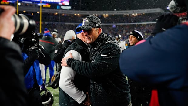 Jan 19, 2025; Orchard Park, New York, USA; Baltimore Ravens head coach John Harbaugh and Buffalo Bills head coach Sean McDerm