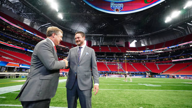 Georgia Bulldogs head coach Kirby Smart greets Oregon Ducks head coach Dan Lanning midfield before the Chick-fil-A kickoff.