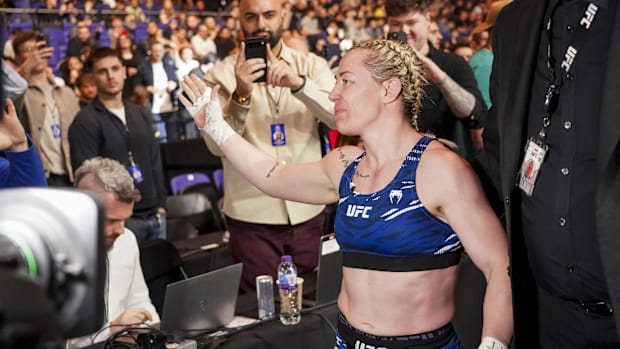 Molly McCann waving to the London audience after losing at UFC Londo