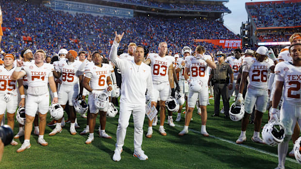 Texas Longhorns head coach Steve Sarkisian stands with his team 
