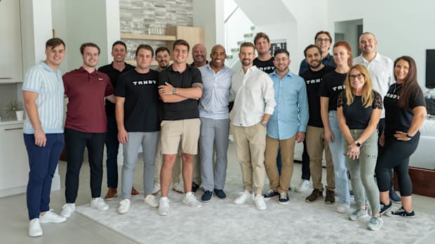 Former Giants running back Tiki Barber on set with some of the TRNDY Social team.