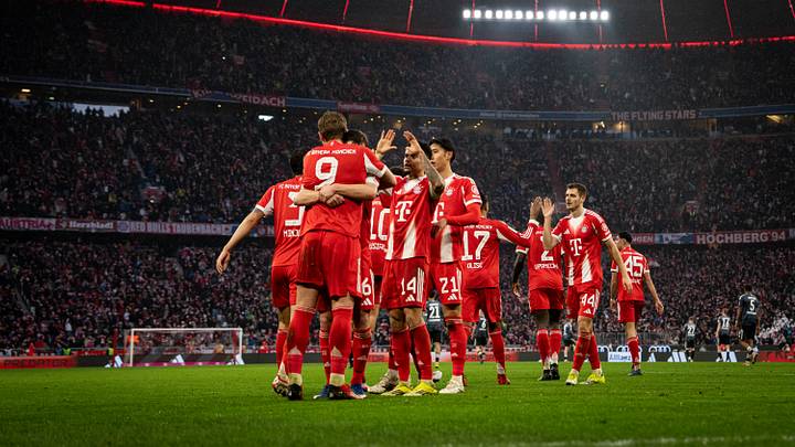 Bayern Munich players celebrating a goal against Eintracht Frankfurt at Allianz Arena on Saturday.