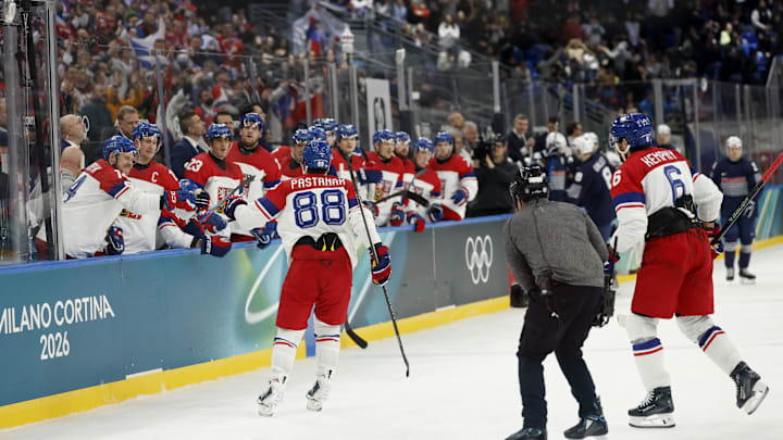 Feb 13, 2026; Milan, Italy;  David Pastrnak of Czech Republic celebrates scoring their third goal with teammates  against France in men's ice hockey group A play during the Milano Cortina 2026 Olympic Winter Games at Milano Santagiulia Ice Hockey Arena. Mandatory Credit: Geoff Burke-Imagn Images