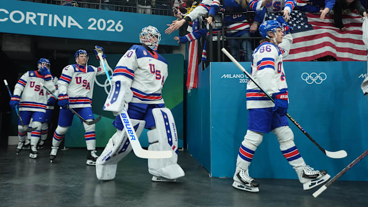 Feb 22, 2026; Milan, Italy; Jake Oettinger (30) of United States heads to the ice with teammates for warmups before playing against Canada in the men's ice hockey gold medal game during the Milano Cortina 2026 Olympic Winter Games at Milano Santagiulia Ice Hockey Arena. Mandatory Credit: Amber Searls-Imagn Images