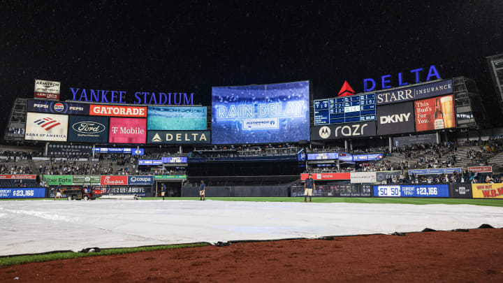 Jun 6, 2024; Bronx, New York, USA;  A rain delay message is displayed on the main scoreboard after the fifth inning of the game between the New York Yankees and the Minnesota Twins at Yankee Stadium. Mandatory Credit: Vincent Carchietta-USA TODAY Sports