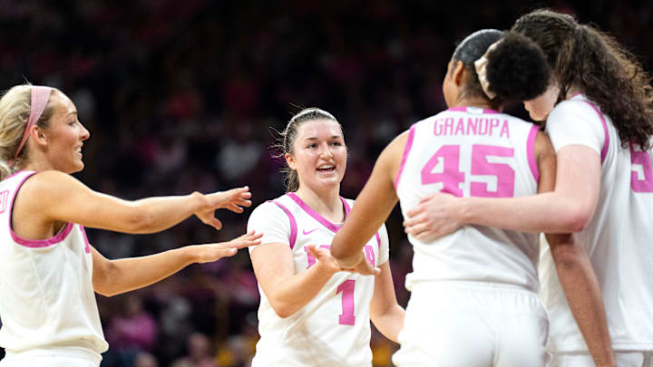 Iowa guard Kylie Feuerbach (4), Iowa guard Taylor Stremlow (1), Iowa forward Hannah Stuelke (45) and Iowa center Ava Heiden (5) huddle during a game against the Washington Huskies Feb. 11, 2026 at Carver-Hawkeye Arena in Iowa City, Iowa.