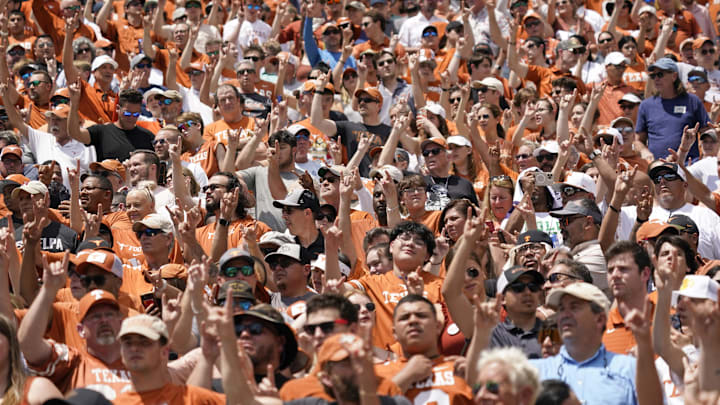 Apr 15, 2023; Austin, TX, USA; Texas Longhorns fans hold up their horns for the Eyes of Texas school song before the Texas Spring Game at DKR- Texas Memorial Stadium. Mandatory Credit: Scott Wachter-Imagn Images