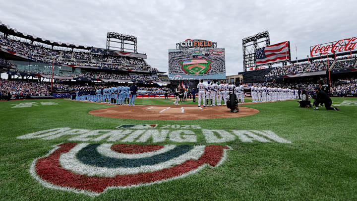 Apr 4, 2025; New York City, New York, USA; New York Mets and Toronto Blue Jays players stand on the baselines for the national anthem before the Mets home opener at Citi Field. Mandatory Credit: Brad Penner-Imagn Images