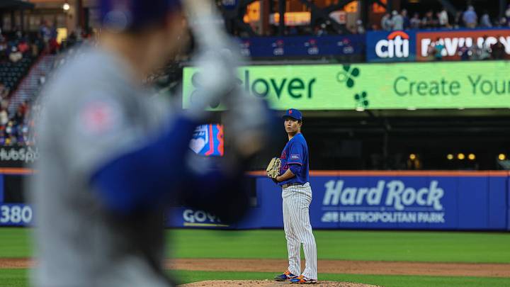 Jun 23, 2026; New York City, New York, USA; New York Mets pitcher Kodai Senga (34) prepares to deliver a pitch during the third inning as Chicago Cubs right fielder Matt Shaw (6) looks on at Citi Field. Mandatory Credit: Vincent Carchietta-Imagn Images