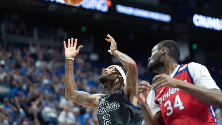 La Familia's Willie Cauley-Stein (2) reaches for the loose ball against 305 Ballers' Victor Uyaelunmo (34) during their game on Friday, July 19, 2024 in Lexington, Ky. at Rupp Arena during the first round of The Basketball Tournament.