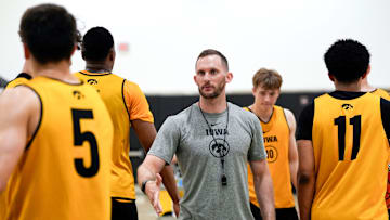 Iowa men’s basketball assistant coach Connor Wheeler high-fives players during practice June 19, 2025 at Carver-Hawkeye Arena in Iowa City, Iowa.