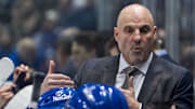 Nov 19, 2024; Vancouver, British Columbia, CAN; Vancouver Canucks head coach Rick Tocchet on the bench against the New York Rangers during the third period at Rogers Arena. Mandatory Credit: Bob Frid-Imagn Images