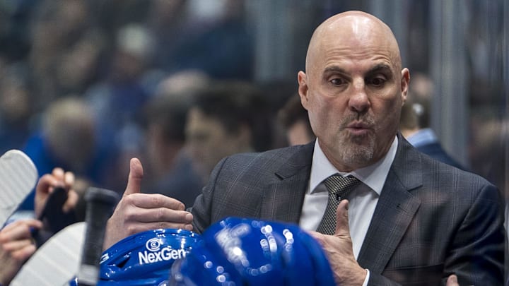 Nov 19, 2024; Vancouver, British Columbia, CAN; Vancouver Canucks head coach Rick Tocchet on the bench against the New York Rangers during the third period at Rogers Arena. Mandatory Credit: Bob Frid-Imagn Images