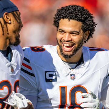 Chicago Bears quarterback Caleb Williams (18) and Chicago Bears safety Jonathan Owens (36) run onto the field before the game against the San Francisco 49ers at Levi's Stadium.