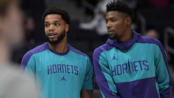 Nov 6, 2024; Charlotte, North Carolina, USA; Charlotte Hornets forward Miles Bridges (0) and forward Brandon Miller (24) during the first quarter against the Detroit Pistons at Spectrum Center. Mandatory Credit: Jim Dedmon-Imagn Images