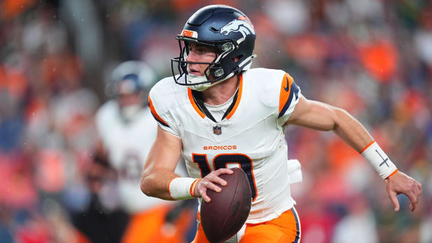 Aug 18, 2024; Denver, Colorado, USA; Denver Broncos quarterback Bo Nix (10) scrambles with the ball in the first quarter