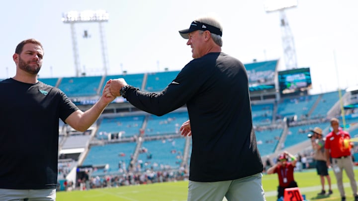 Jacksonville Jaguars head coach Doug Pederson, right, fist bumps offensive coordinator Press Taylor before an NFL football matchup Sunday, Sept. 24, 2023 at EverBank Stadium in Jacksonville, Fla. 