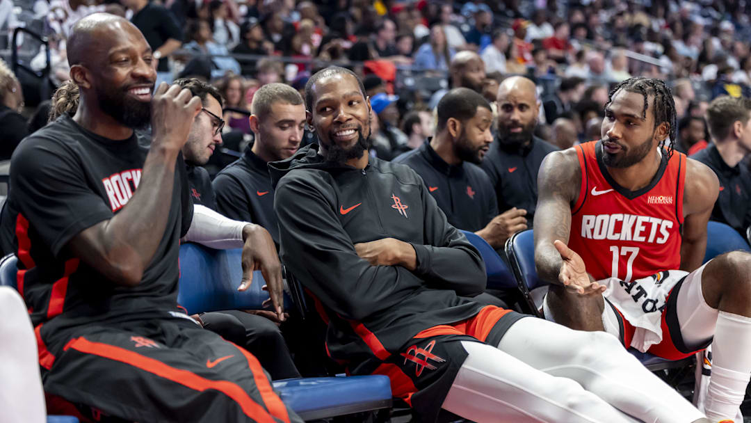Oct 14, 2025; Birmingham, Alabama, USA; Houston Rockets forward Jeff Green and Houston Rockets forward Kevin Durant (7) and Houston Rockets forward Tari Eason (17) share a moment on the bench during the second half of an NBA preseason game against the New Orleans Pelicans at Legacy Arena at BJCC. Mandatory Credit: Vasha Hunt-Imagn Images