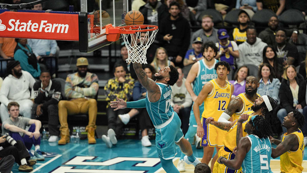 Jan 27, 2025; Charlotte, North Carolina, USA; Charlotte Hornets forward Miles Bridges (0) shoots a layup against the Los Angeles Lakers during the second half at the Spectrum Center. Mandatory Credit: Jim Dedmon-Imagn Images